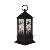 Lanterne noire d'Halloween avec bougie lumineuse